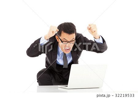 happy businessman raise his hands to yell 32219533