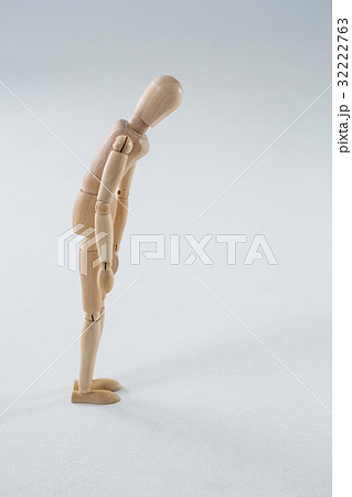 Wooden figurine on white background 32222763