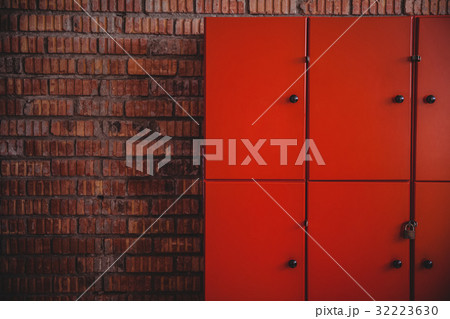 Lockers placed against brick wall Lockers placed against brick wall 32223630
