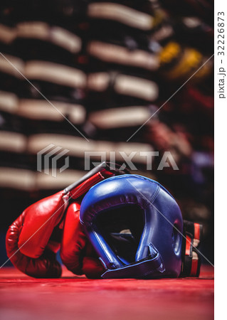 Boxing gloves and headgear in boxing ring Boxing gloves and headgear in boxing ring 32226873