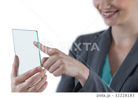 Businesswoman pretending to use mobile phone Businesswoman pretending to use mobile phone 32228183