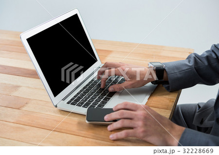 Businessman using laptop Businessman using laptop 32228669