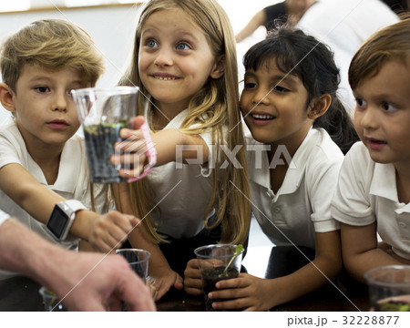 Group of diverse kindergarten students learning planting in science class Group of diverse kindergarten students learning planting in science class 32228877