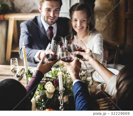 People Cling Wine Glasses on Wedding Reception with Bride and Groom People Cling Wine Glasses on Wedding Reception with Bride and Groom 32229009