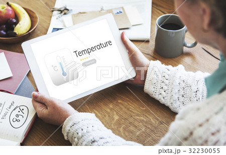 Woman working on digital device network graphic overlay 32230055