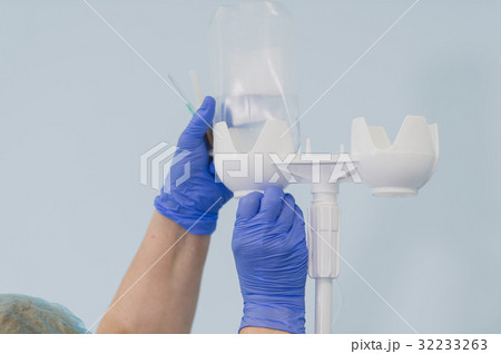 Doctor's hands and infusion drip in hospital on 32233263