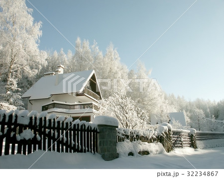Cottage surrounded by winter scenery 32234867