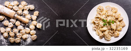 Plate of russian pelmeni, ravioli or dumplings 32235169