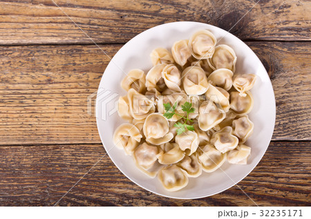 Plate of russian pelmeni, ravioli or dumplings 32235171