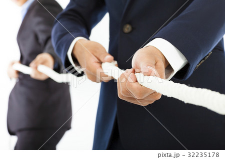 businessman work together and playing tug of war businessman work together and playing tug of war 32235178