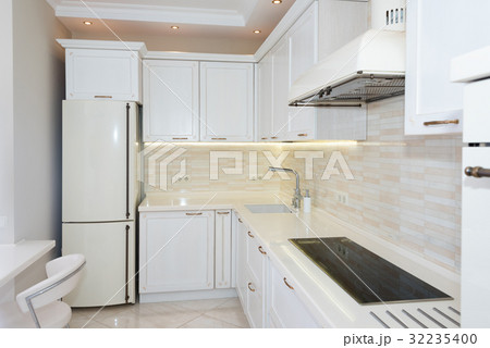 Modern, bright, clean kitchen interior in a luxury Modern, bright, clean kitchen interior in a luxury 32235400