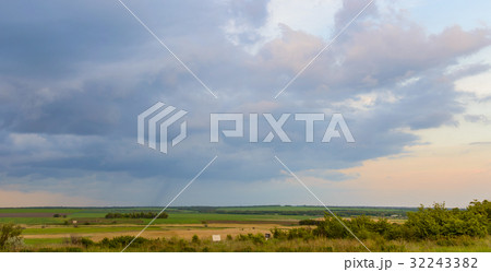 Summer landscape with dramatic sky on sunset 32243382