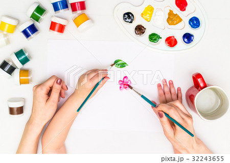 Child painting a flower Child painting a flower 32243655
