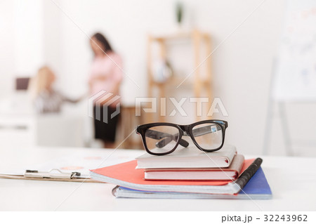 Close up of office workplace with colleagues in Close up of office workplace with colleagues in 32243962