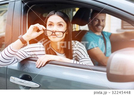 Pretty woman being surprised at something in the 32245448