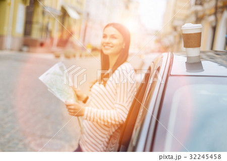 Pretty woman enjoying the sun during car stop 32245458