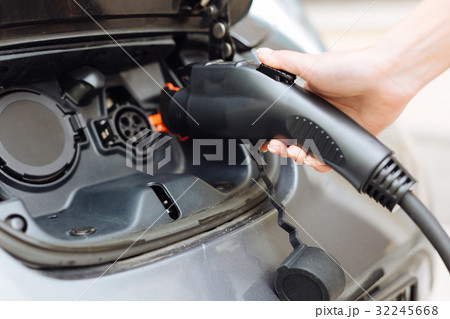 Close up of electrical nozzle for charging e-car 32245668