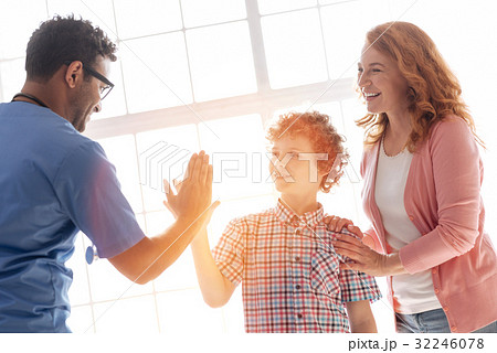 Pretty woman putting hand on the shoulder of her 32246078