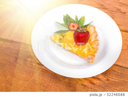 Slice of fruit pizza with strawberries and mint 32246088