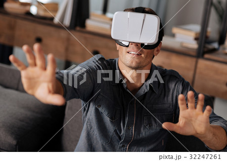 Charming energetic man testing newest VR gear 32247261