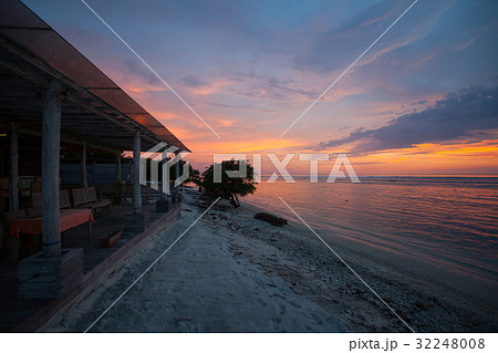 Cafes and beach on the shore of the sea at sunset Cafes and beach on the shore of the sea at sunset 32248008