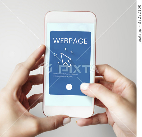 Hands working on digital device network graphic overlay 32252100