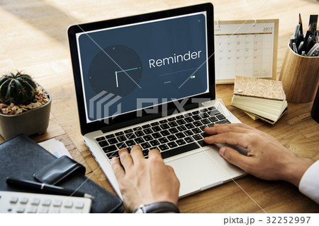 People using laptop with clock and time icon 32252997