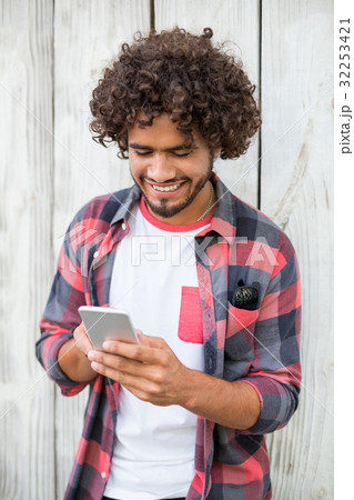 Young man using mobile phone 32253421