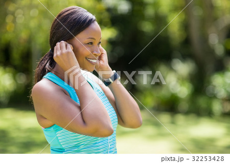 Happy woman listening music Happy woman listening music 32253428