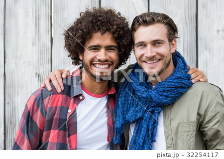 Portrait of friends with arm around 32254117