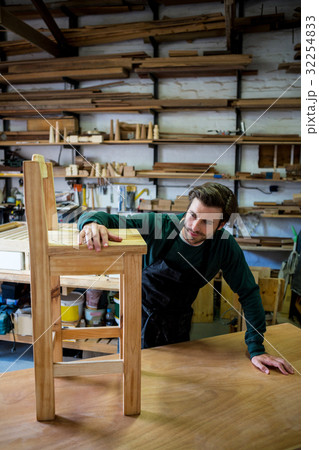 Carpenter working on his craft 32254833