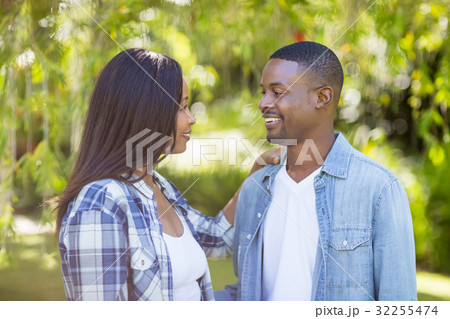Happy couple looking each other Happy couple looking each other 32255474