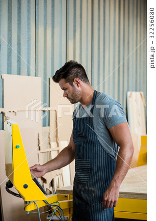 Carpenter working on his craft 32256080