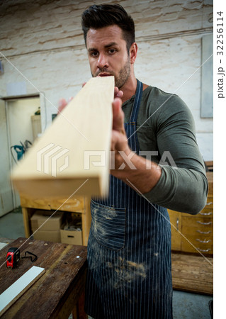 Carpenter working on his craft 32256114