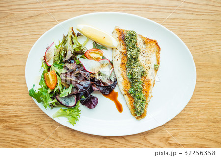 Grilled sea bass fish meat steak with vegetable 32256358