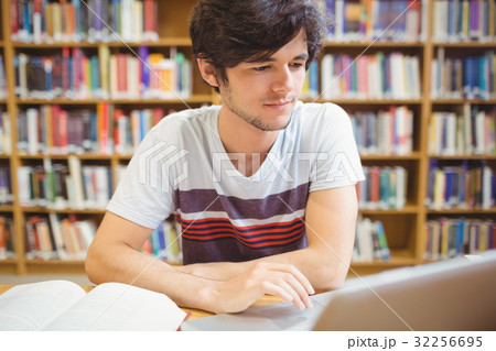Young student using his laptop 32256695