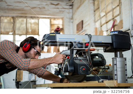Carpenter working on his craft 32256756