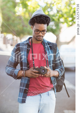 Young man looking into camera Young man looking into camera 32257536