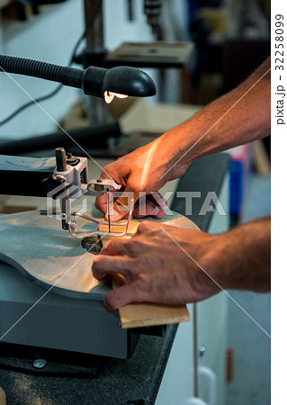 Carpenter working on his craft 32258099