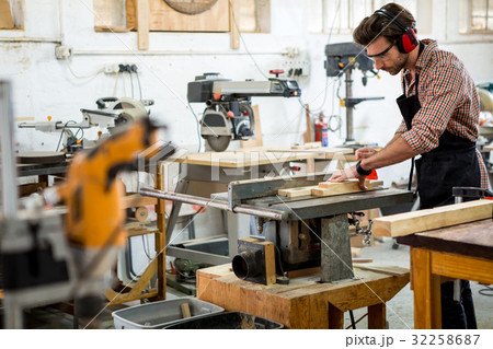 Carpenter working on his craft 32258687