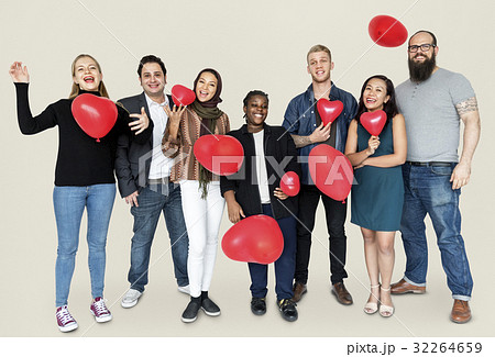 Group of Diverse People Holding Heart Balloons Cheerfully 32264659