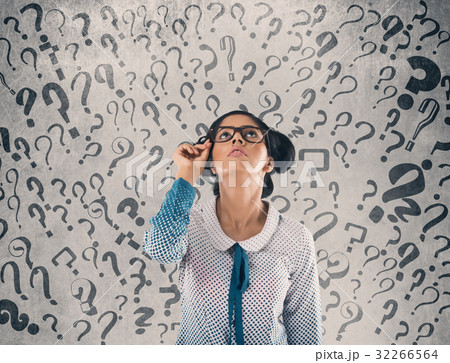 Shocked businessman in front of wall 32266564