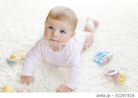 Cute baby girl playing with colorful pastel Cute baby girl playing with colorful pastel 32267818