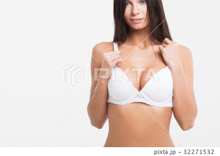 Young beautiful girl shows her gorgeous Breasts Young beautiful girl shows her gorgeous Breasts 32271532