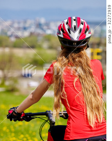 Bikes cycling girl wearing helmet. 32272939