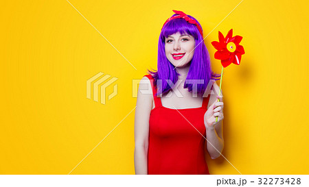 girl with pinwheel toy girl with pinwheel toy 32273428