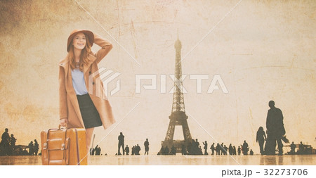 Redhead girl with suitcase and Eiffel tower 32273706