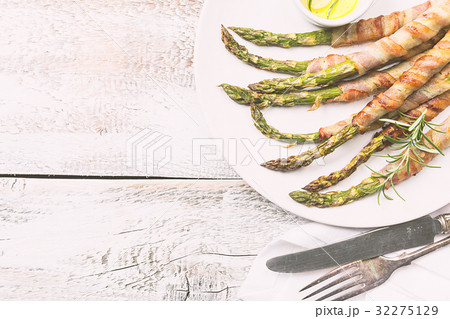 Grilled green asparagus wrapped with bacon Grilled green asparagus wrapped with bacon 32275129