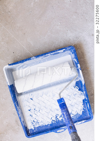 Bucket with paint and a brush roller paint tray Bucket with paint and a brush roller paint tray 32275600