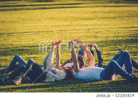 Multi-ethnic group of friends taking a selfie with Multi-ethnic group of friends taking a selfie with 32283824